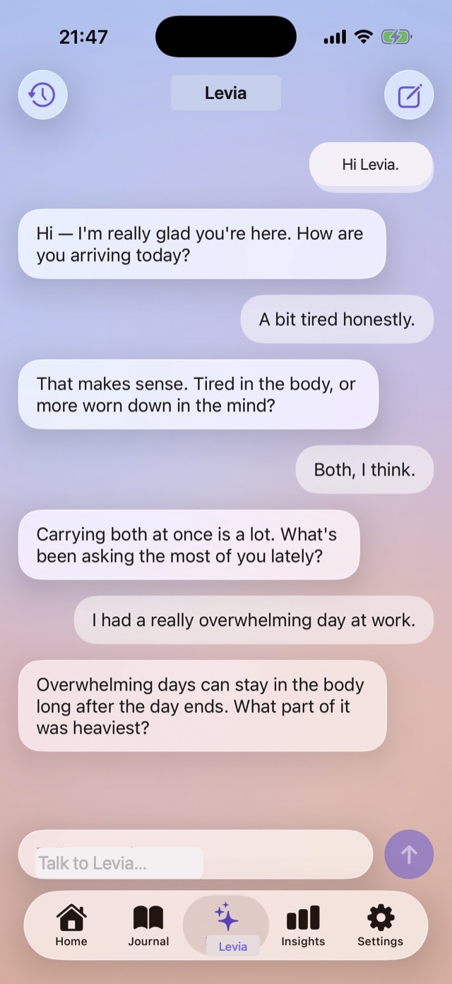 A conversation with Levia, the AI companion, gently asking reflective questions about a tiring day